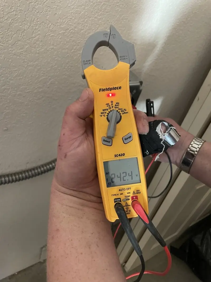 Voltage testing with clamp meter during Recessed Lighting Installation in Casa Grande